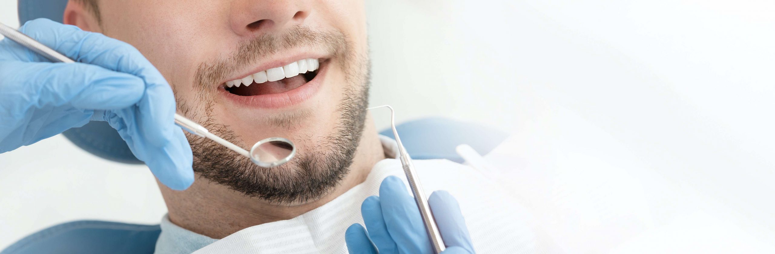 man getting teeth cleaned man getting teeth cleaned